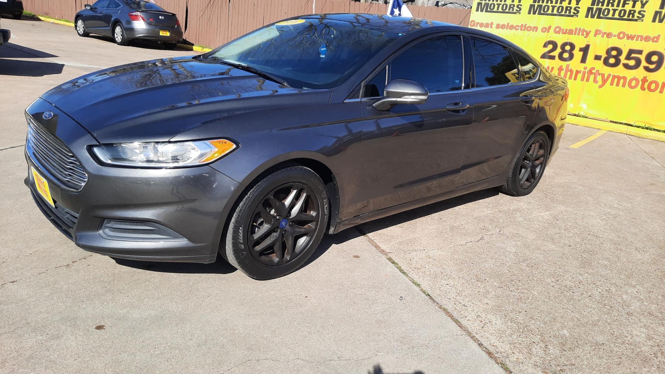 2016 Ford Fusion (3FA6P0H71GR) , located at 16710 Clay Rd., Houston, TX, 77084, (281) 859-7900, 29.834864, -95.656166 - Photo #2